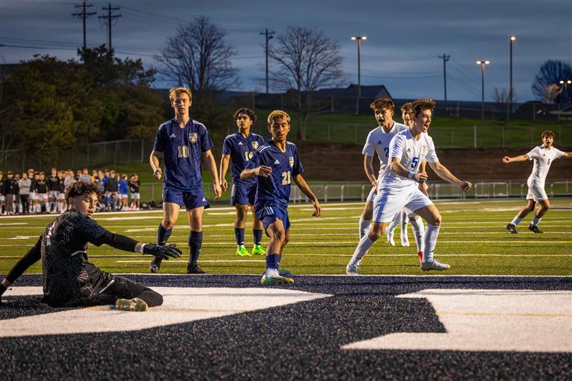 Students play soccer